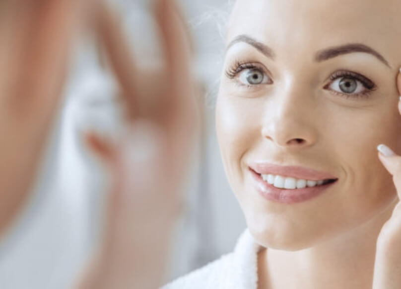 Beautiful Woman Looking Into The Mirror